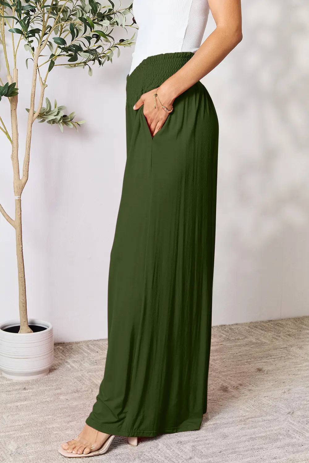 Dark gray Trendsi Basic Bae full-size smocked wide waistband wide-leg pants displayed on a model.