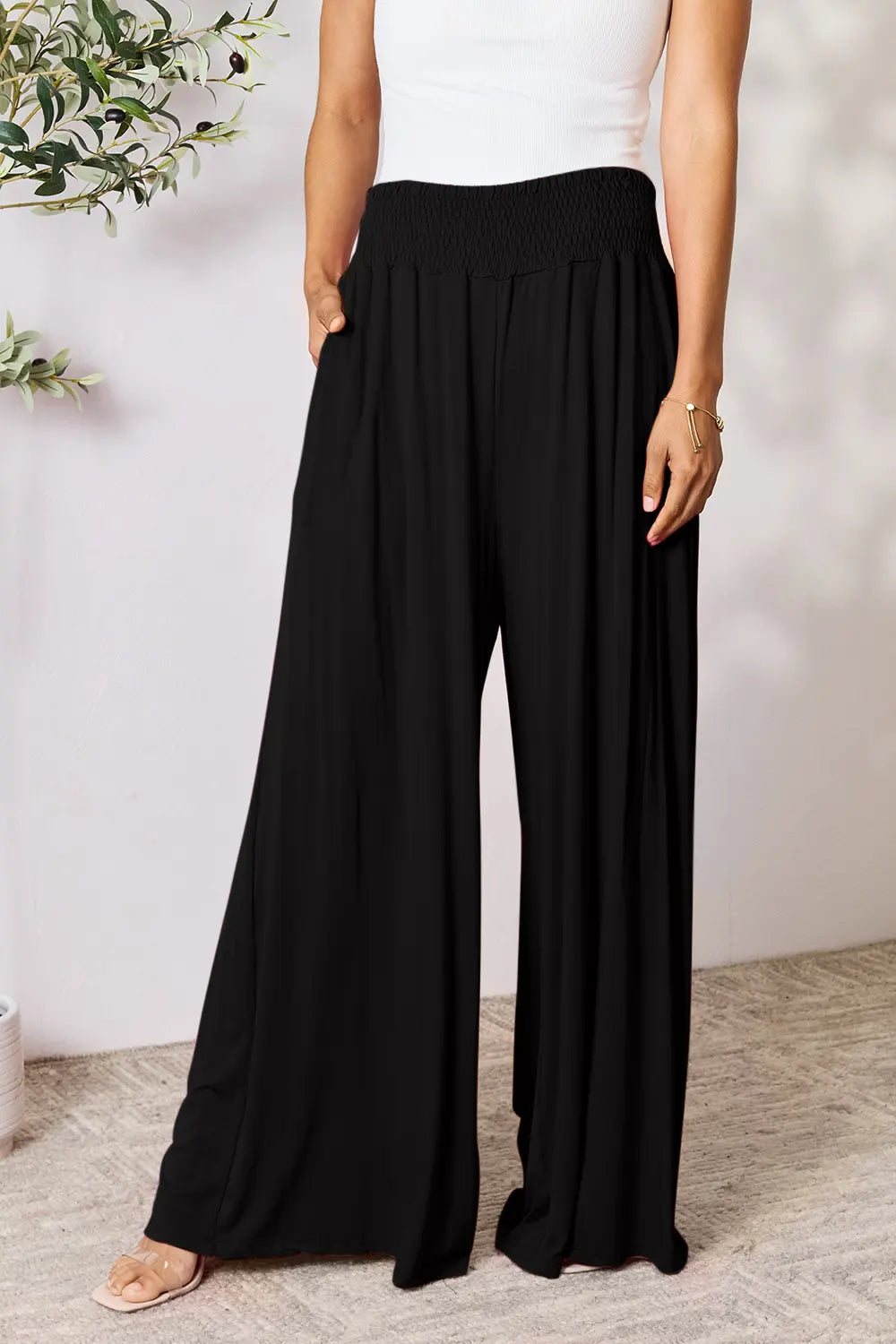 Dark gray Trendsi Basic Bae full-size smocked wide waistband wide-leg pants laid flat on a white background.