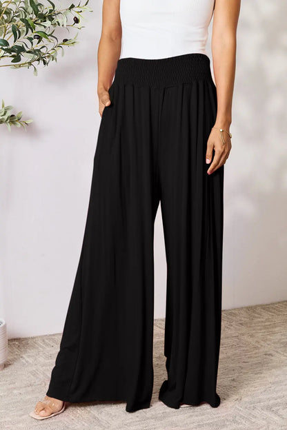 Dark gray Trendsi Basic Bae full-size smocked wide waistband wide-leg pants laid flat on a white background.