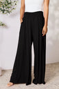 Dark gray Trendsi Basic Bae full-size smocked wide waistband wide-leg pants laid flat on a white background.