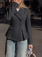 Dark gray double-breasted peplum blazer by Trendsi, featuring structured design and stylish lapels, displayed on a plain background.