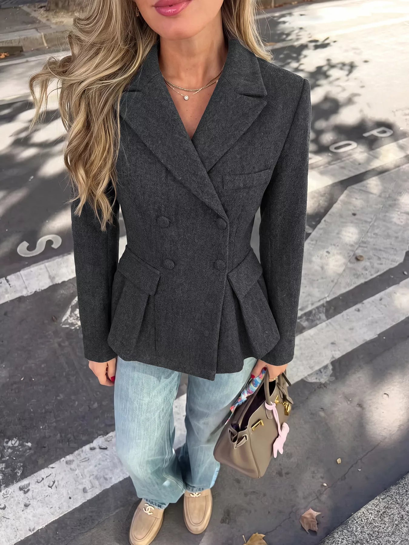 Dark gray double-breasted peplum blazer by Trendsi, tailored fit with structured lapels and stylish design, shown front view.