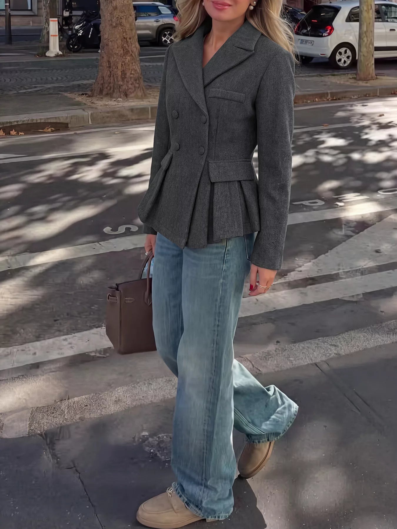 Dark gray double-breasted peplum blazer from Trendsi, showing tailored fit and structured design with buttons on front.