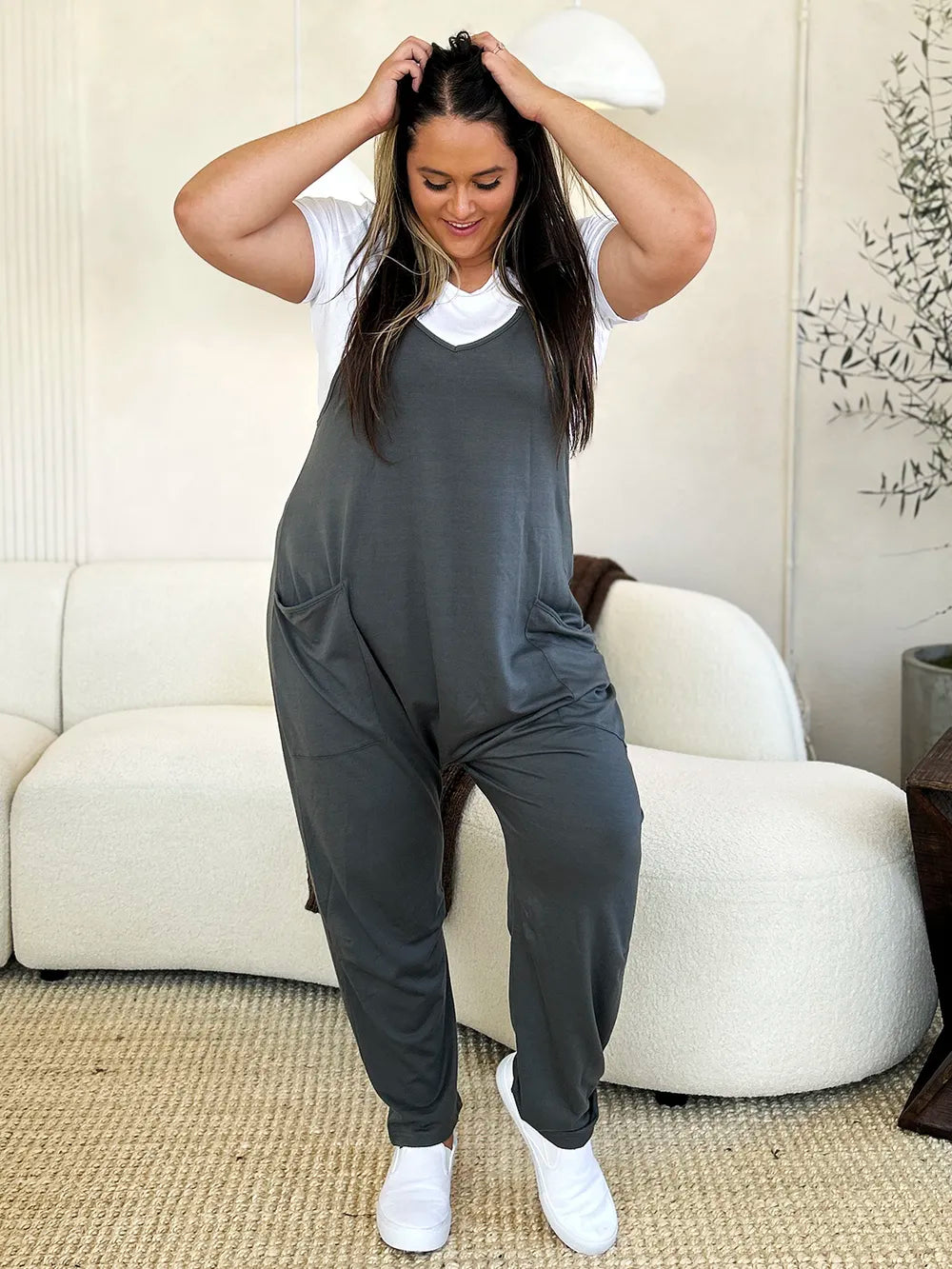 Dark gray Trendsi Double Take sleeveless V-neck jumpsuit with front pockets, full size, casual and stylish for everyday wear.