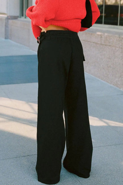 Dark gray wide leg jeans with pockets from Trendsi, featuring a relaxed fit and stylish casual design.