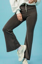 Dark gray high-waisted flare leggings by Umgee for women, featuring a fitted waistband and wide-leg design.