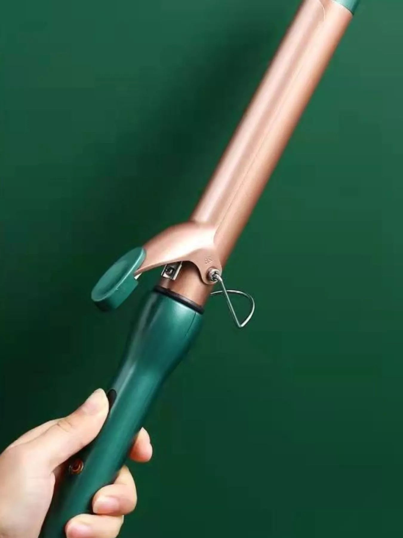 Dark green adjustable temperature curling iron wand by Trendsi with European plug, suitable for creating styled curls.