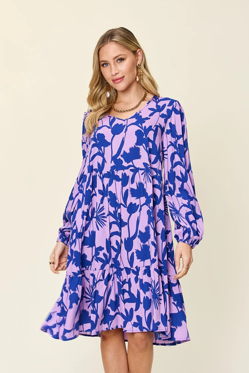 Dark green double take full-size printed ruffle hem dress with pockets by Trendsi, featuring a stylish ruffle detail and comfortable fit.