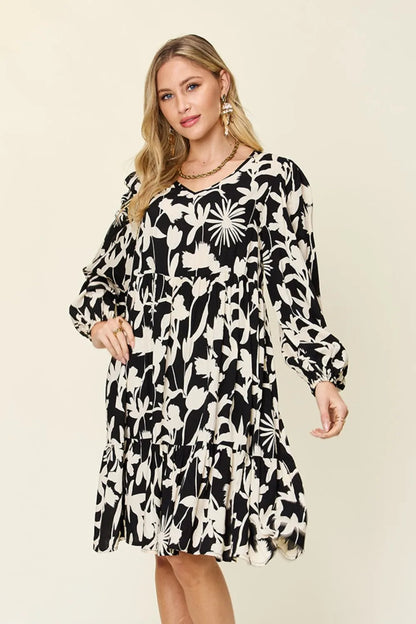 Dark green double take full-size printed ruffle hem dress with pockets by Trendsi, featuring a stylish flowy design and ruffled details.