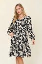 Dark green double take full-size printed ruffle hem dress with pockets by Trendsi, featuring a stylish flowy design and ruffled details.