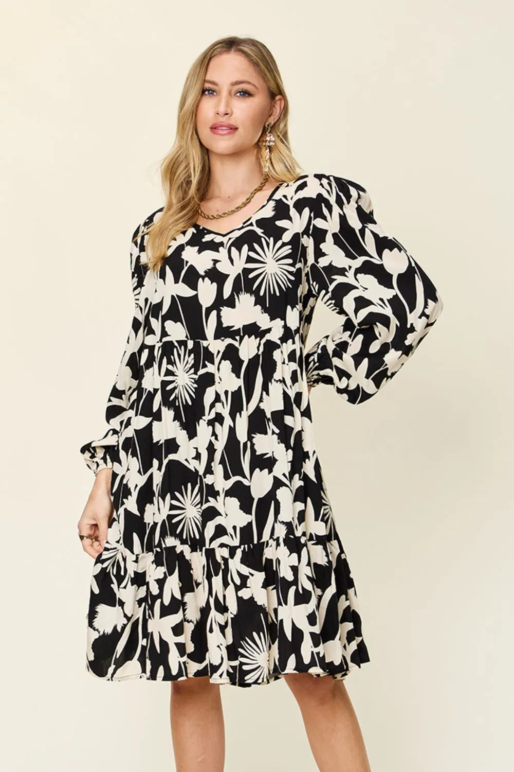 Dark green double take full-size printed ruffle hem dress with pockets, featuring a stylish and comfortable design by Trendsi.