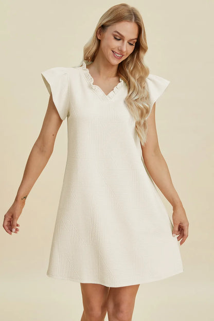 Dark green Double Take full-size ruffled V-neck dress with cap sleeves from Trendsi, showcasing elegant ruffle details and fitted silhouette.