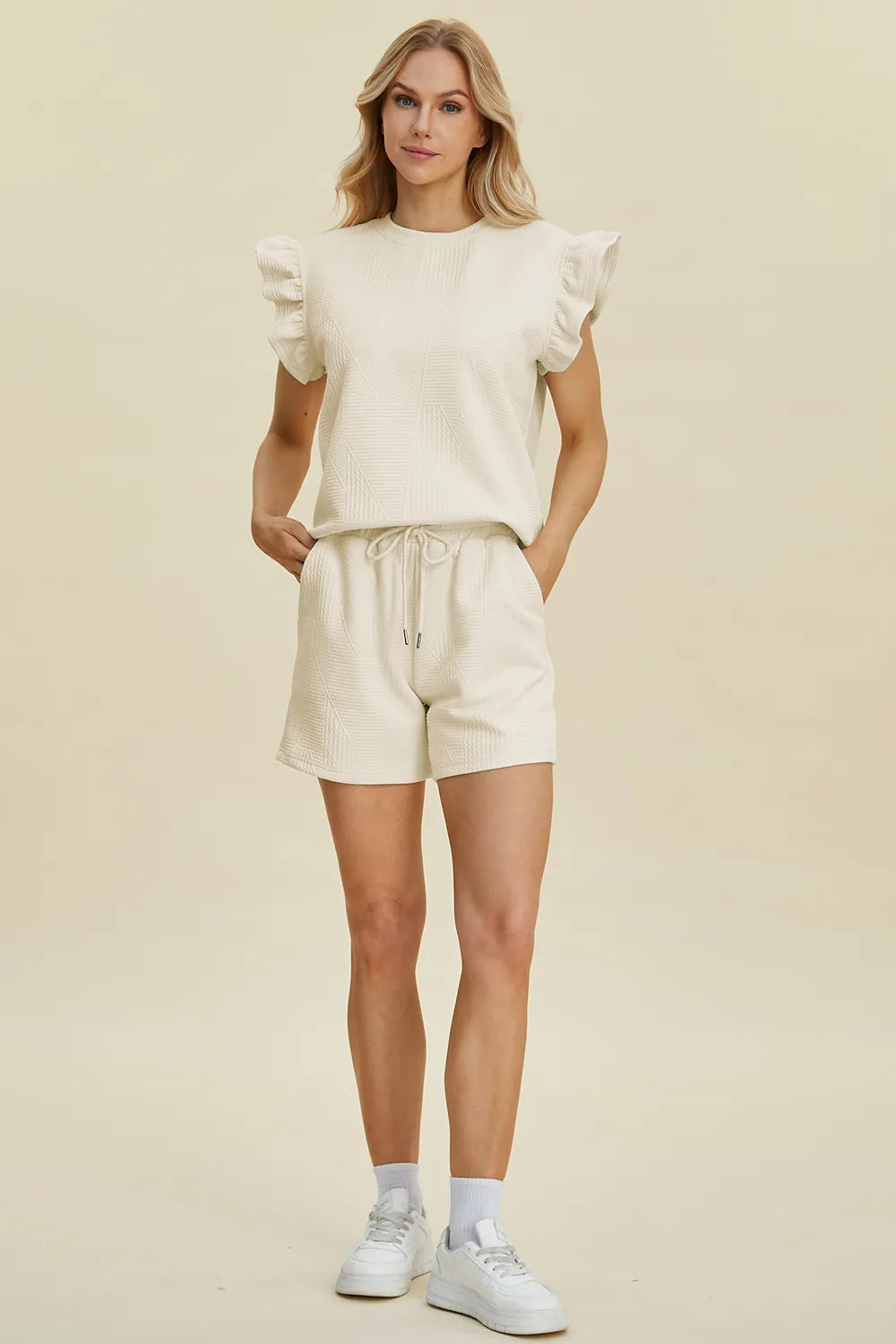 Dark green Trendsi double take full-size textured round neck top with ruffle sleeves and matching shorts set on a model.