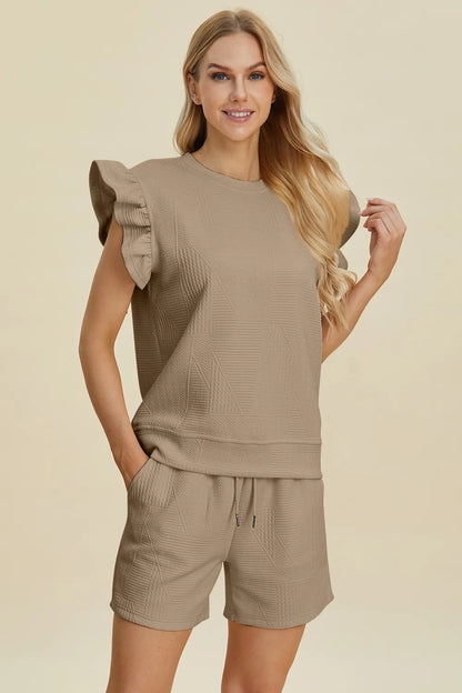 Dark green Trendsi Double Take textured round neck top with ruffle sleeves and matching shorts set, casual and stylish for warm weather.