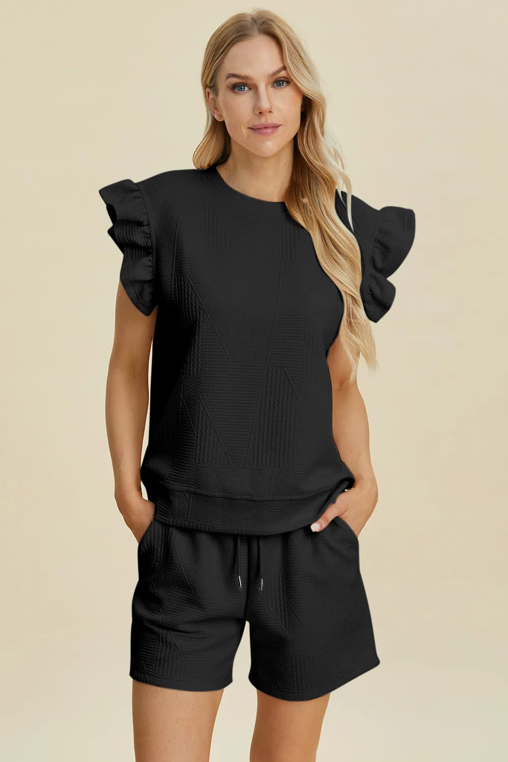 Dark green Trendsi double take full-size textured round neck ruffle sleeve top and matching shorts set on a model.