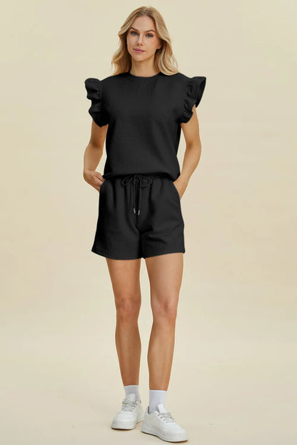 Dark green Trendsi double take full-size texture round neck ruffle sleeve top and matching shorts set on a model.
