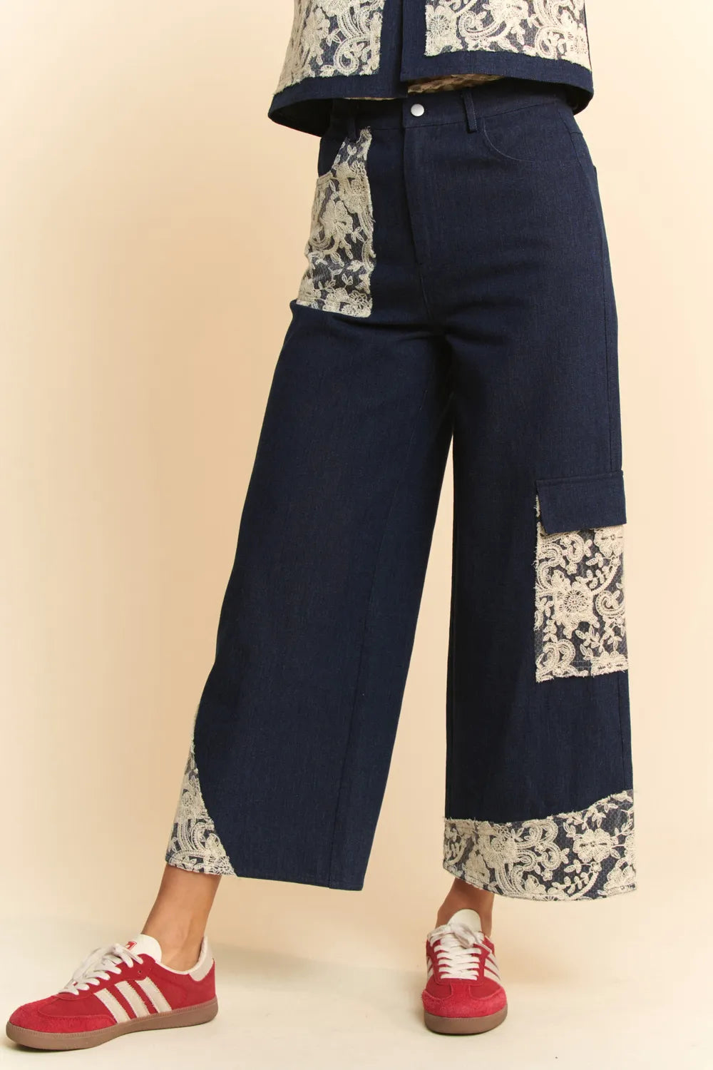 Dark wash Davi & Dani lace applique wide-leg jeans featuring decorative lace details and a relaxed fit.