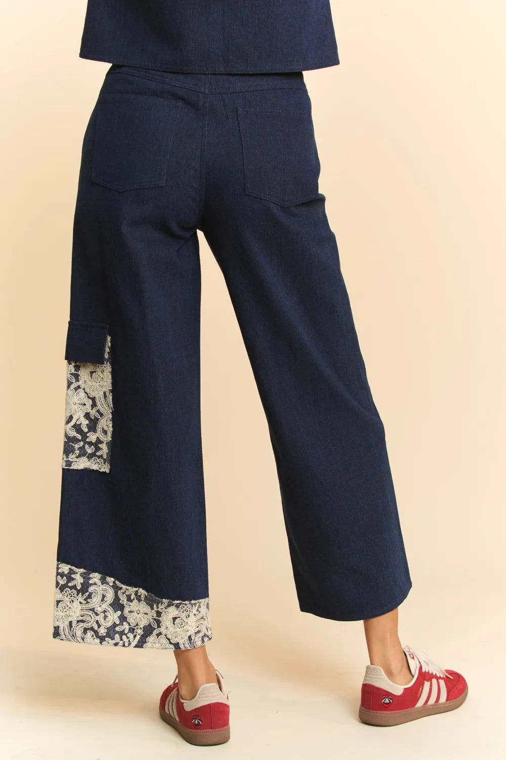 Dark wash Davi & Dani lace applique wide leg jeans from Trendsi, featuring lace details and a relaxed fit.