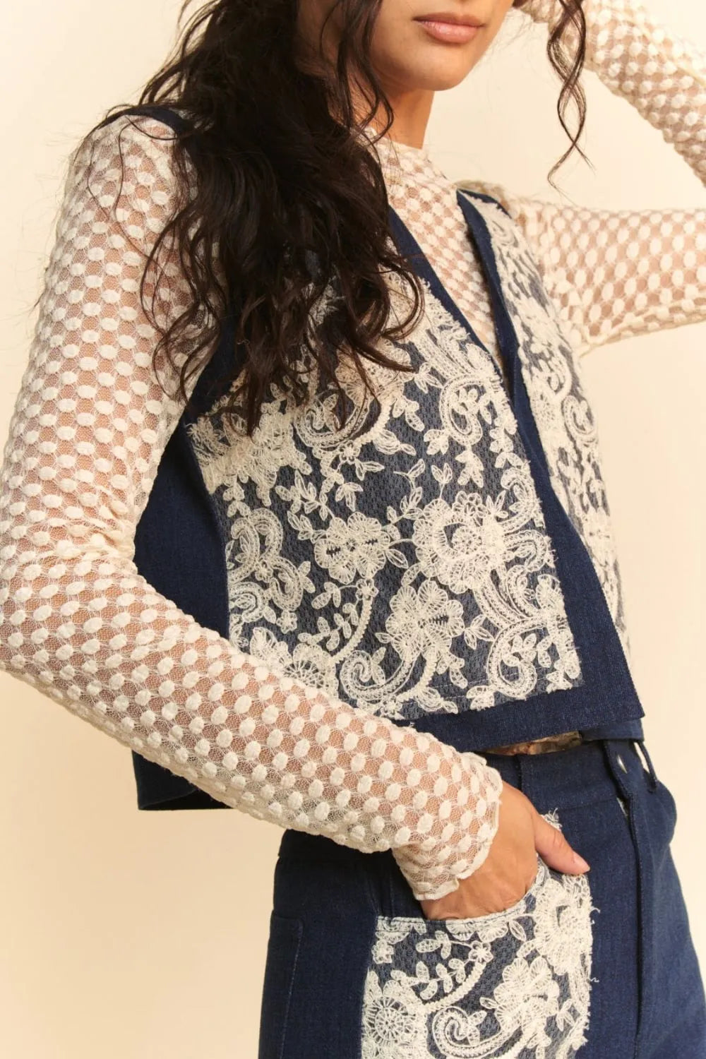 Dark denim open front vest with lace patch details from Davi & Dani, styled with casual fashion.