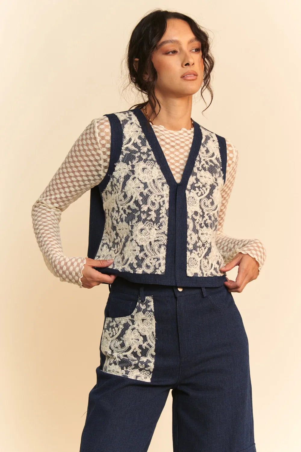 Dark blue Davi & Dani lace patch open front denim vest with distressed details and front pockets, stylish and trendy.