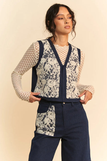 Dark blue Davi & Dani lace patch open front denim vest with distressed details and front pockets, stylish and trendy.