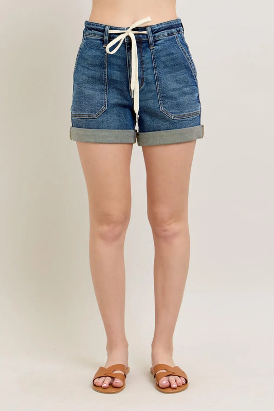 Dark wash Judy Blue full-size high-rise cuff denim shorts, plus size, featuring a classic cuffed hem and high-rise fit.