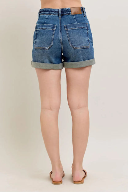 Dark wash Judy Blue full size high-rise cuff denim shorts for plus size women, showcasing the stylish cuff detail and comfortable fit.