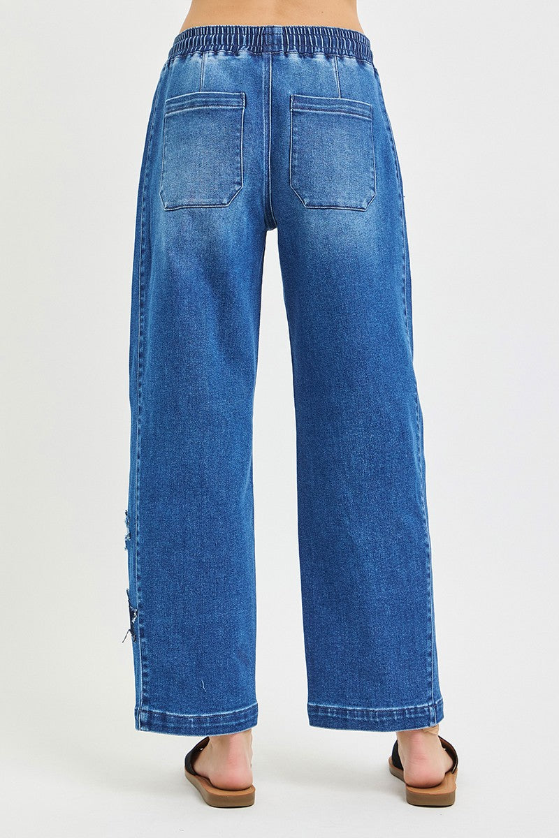 Dark grey RISEN elastic band slouchy cropped barrel pants with star patch by Trendsi, featuring a relaxed fit and casual style.