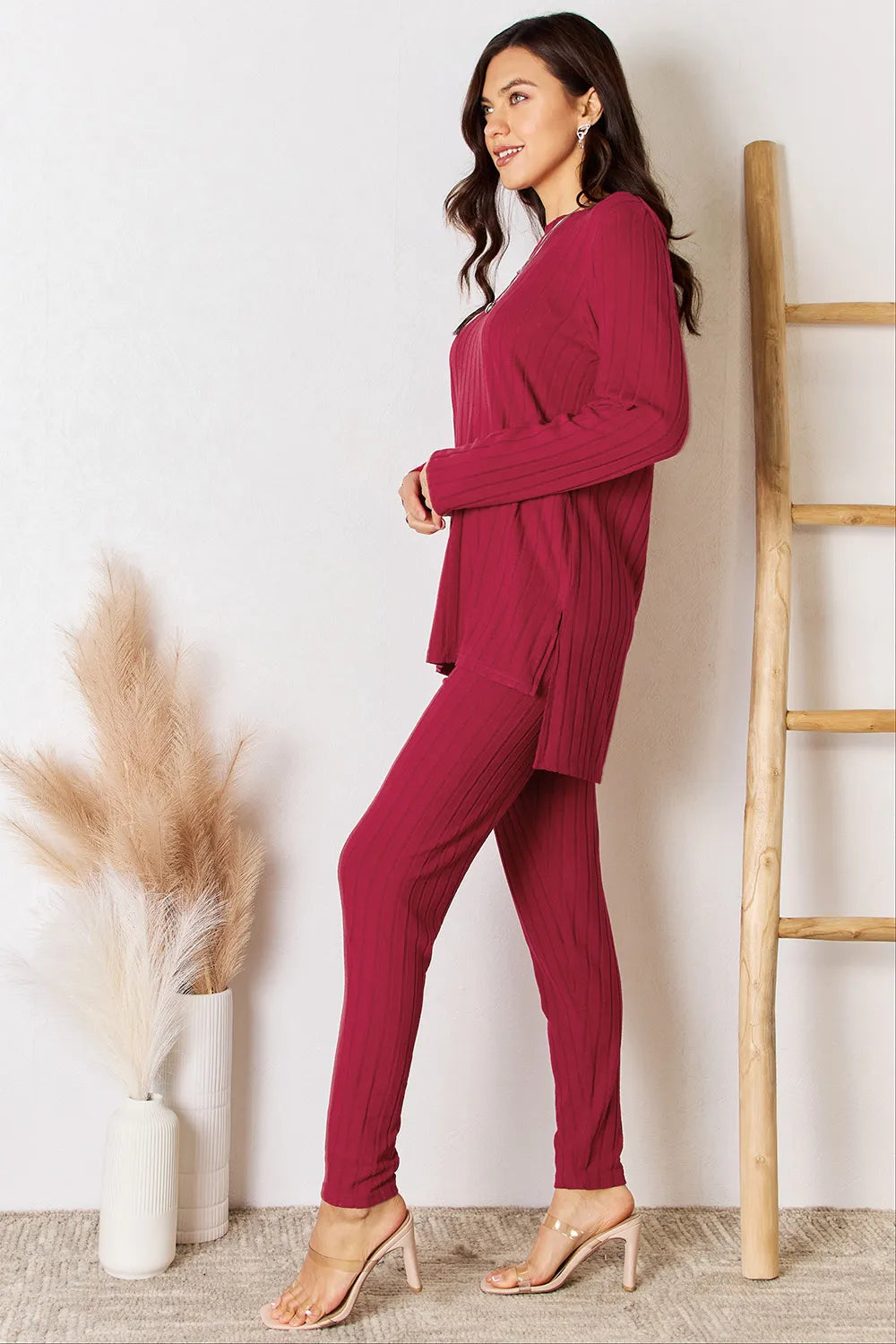 Deep red ribbed high-low slit top and matching pants set by Trendsi, featuring a round neckline and comfortable fit.