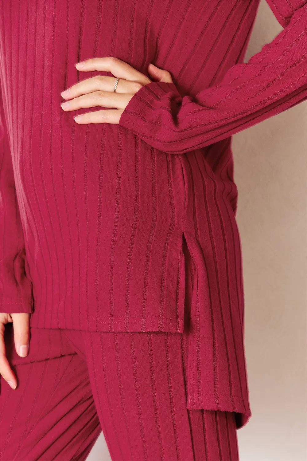 Deep red Trendsi Basic Bae ribbed set featuring a round neck high-low slit top and matching pants, stylish and comfortable.