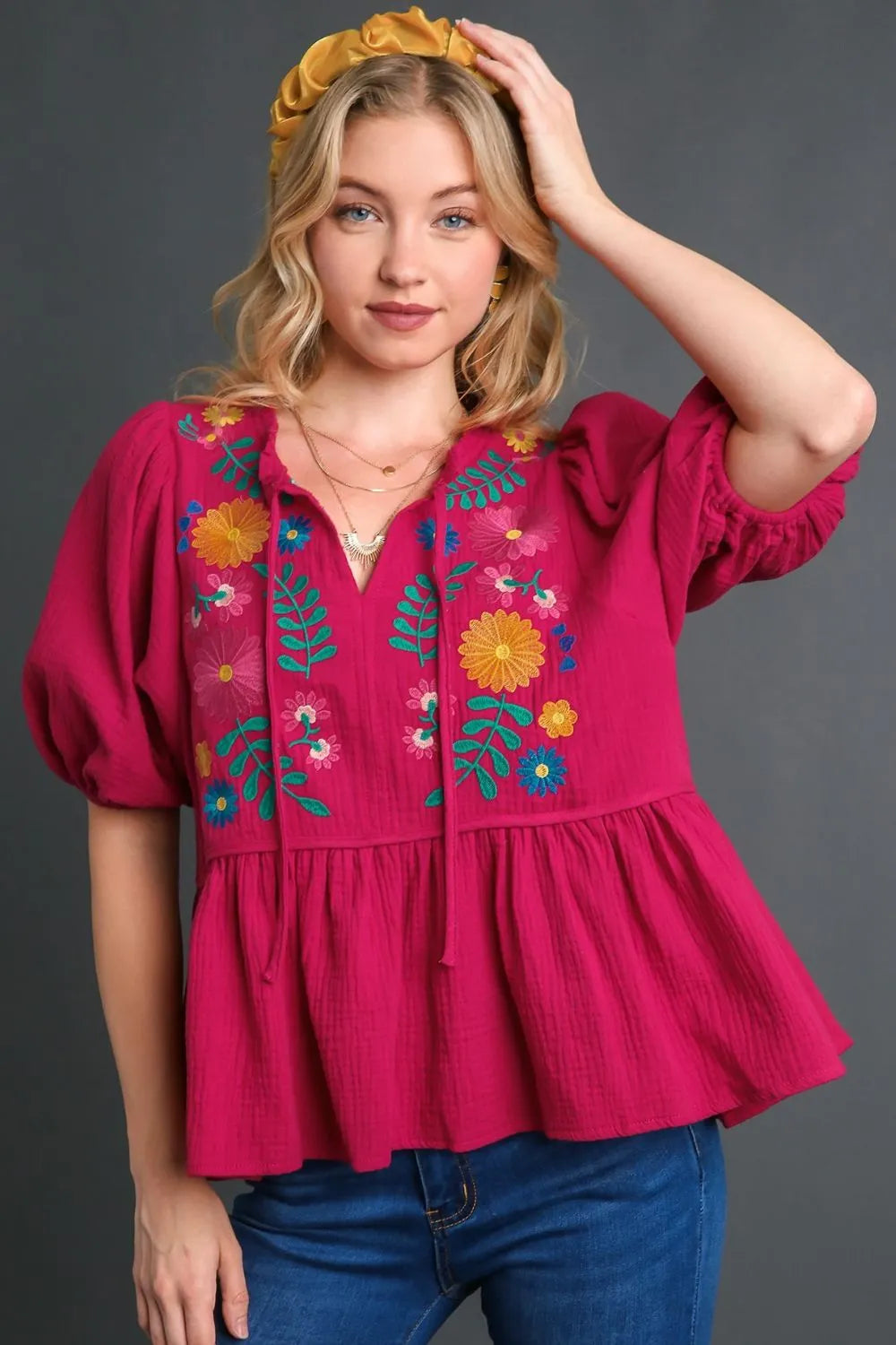 Deep rose plus size Umgee cotton gauze babydoll blouse with floral embroidery, featuring a flowy, relaxed fit and feminine details.