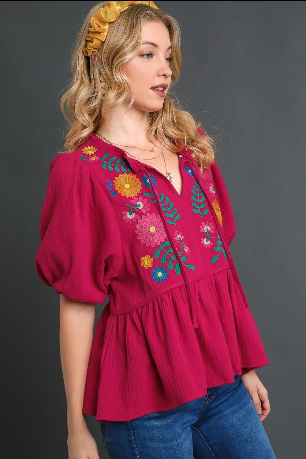 Deep rose plus size Umgee cotton gauze babydoll blouse with floral embroidery, featuring a relaxed fit and feminine design.