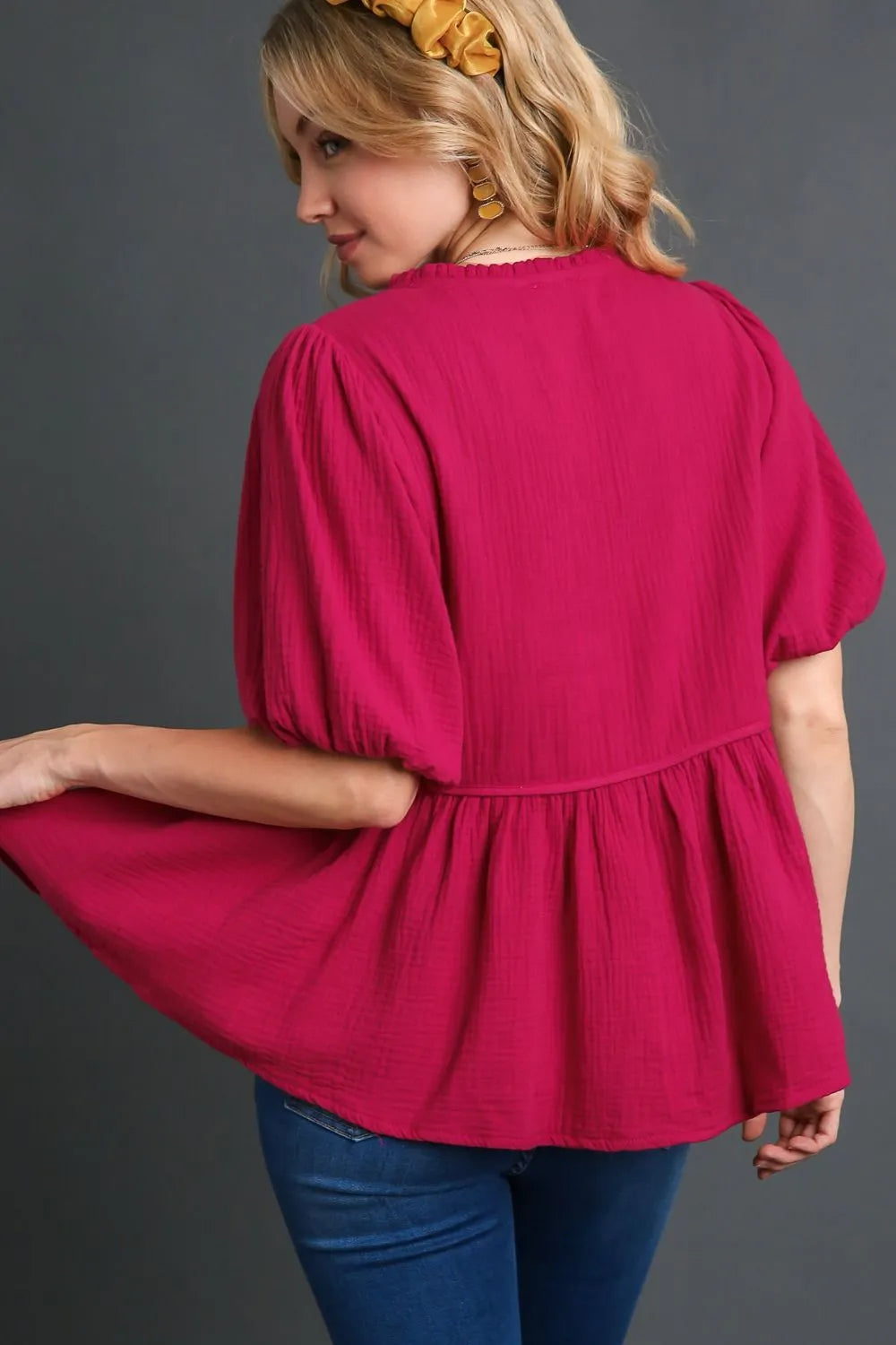Deep rose plus size Umgee cotton gauze floral embroidery babydoll blouse with relaxed fit and delicate embroidery details.