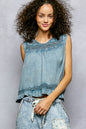 Denim blue sleeveless cotton blouse with ruffled details, button closure at back, and trim accents by Trendsi.