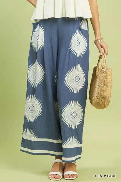 Trendsi Umgee denim blue abstract border print wide-leg pants with relaxed fit and stylish design.