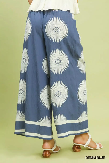 Blue Umgee abstract border print wide-leg pants with a relaxed fit, stylish design, and comfortable fabric.