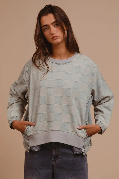 Mineral washed checkered round neck denim top by Trendsi, featuring a casual fit and stylish design.