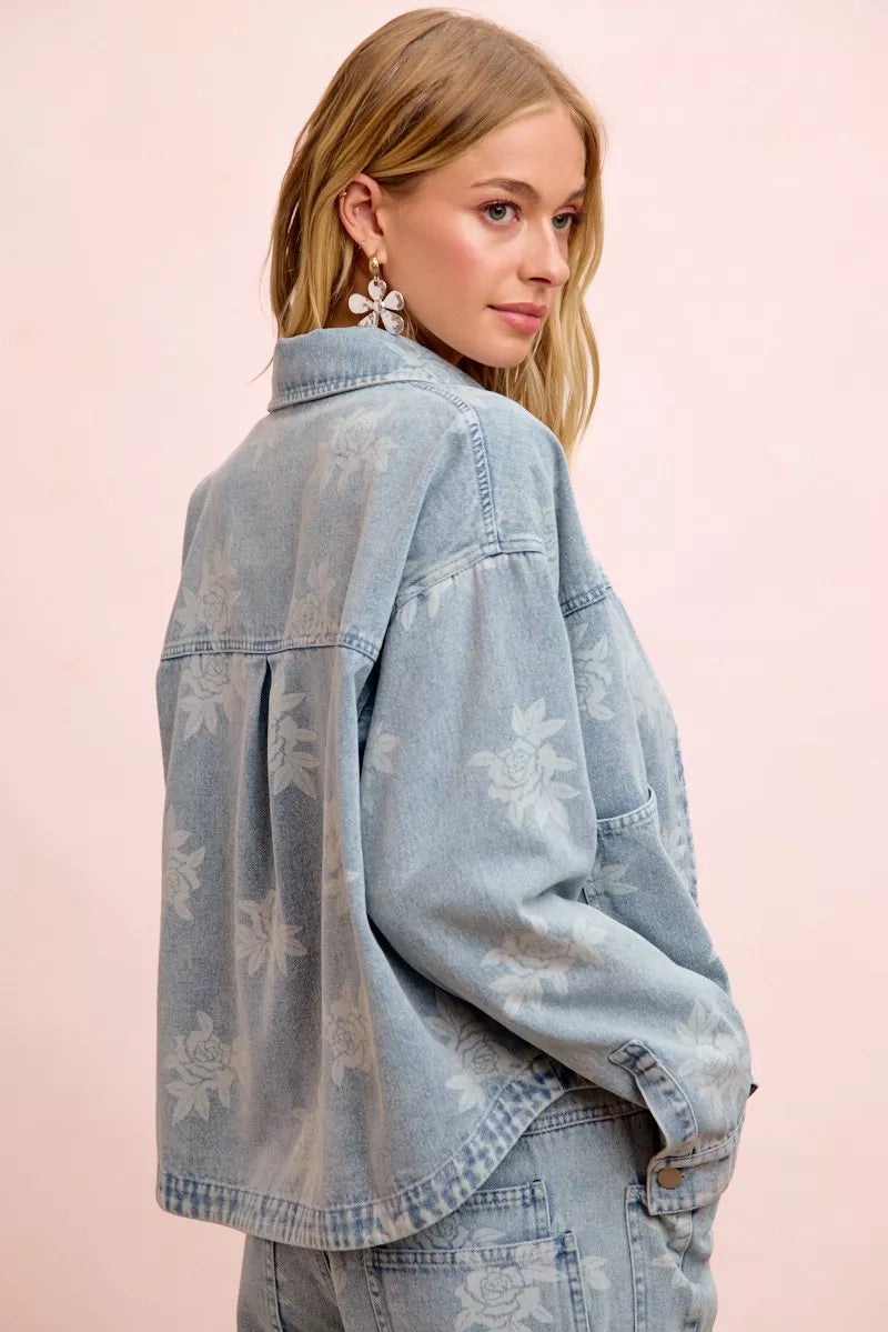 Trendsi BiBi printed washed denim jacket featuring a front pocket and stylish design, displayed on a hanger.
