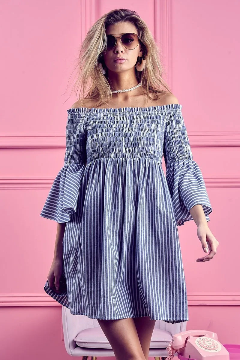Trendsi BiBi smocked off-shoulder striped dress featuring a fitted bodice and casual summer style, shown on a model.