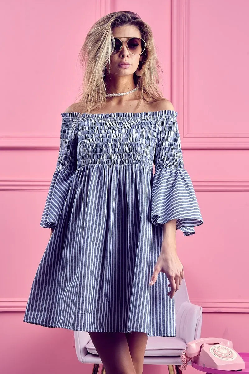Trendsi BiBi smocked off-shoulder striped dress featuring a fitted bodice and relaxed skirt, perfect for summer wear.