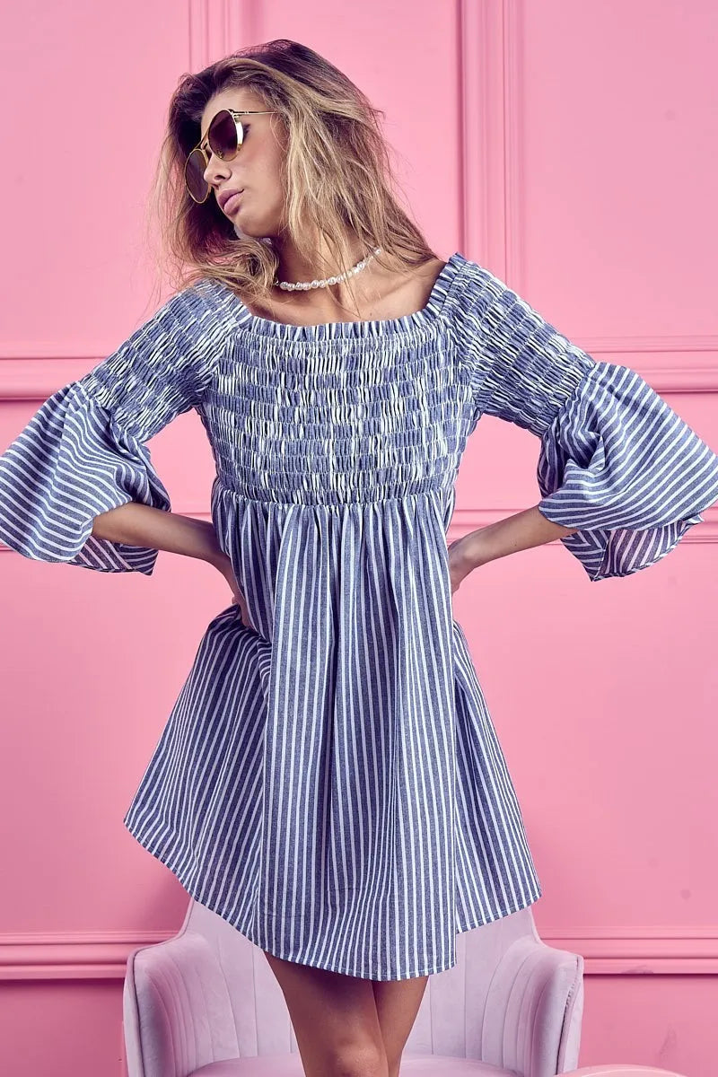 Blue and white striped BiBi Smocked Off Shoulder Dress by Trendsi featuring a flattering off-shoulder design and smocked bodice.