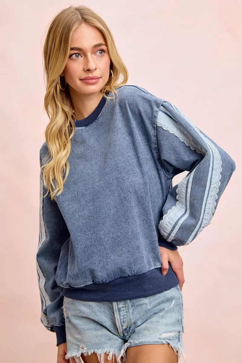 BiBi washed denim sweatshirt with lace contrast sides, casual long sleeve top by Trendsi, stylish and comfortable denim fashion.