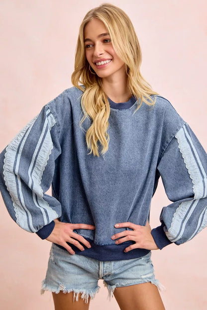 BiBi washed denim sweatshirt with lace contrast sides, casual long-sleeve top from Trendsi featuring distressed denim details.