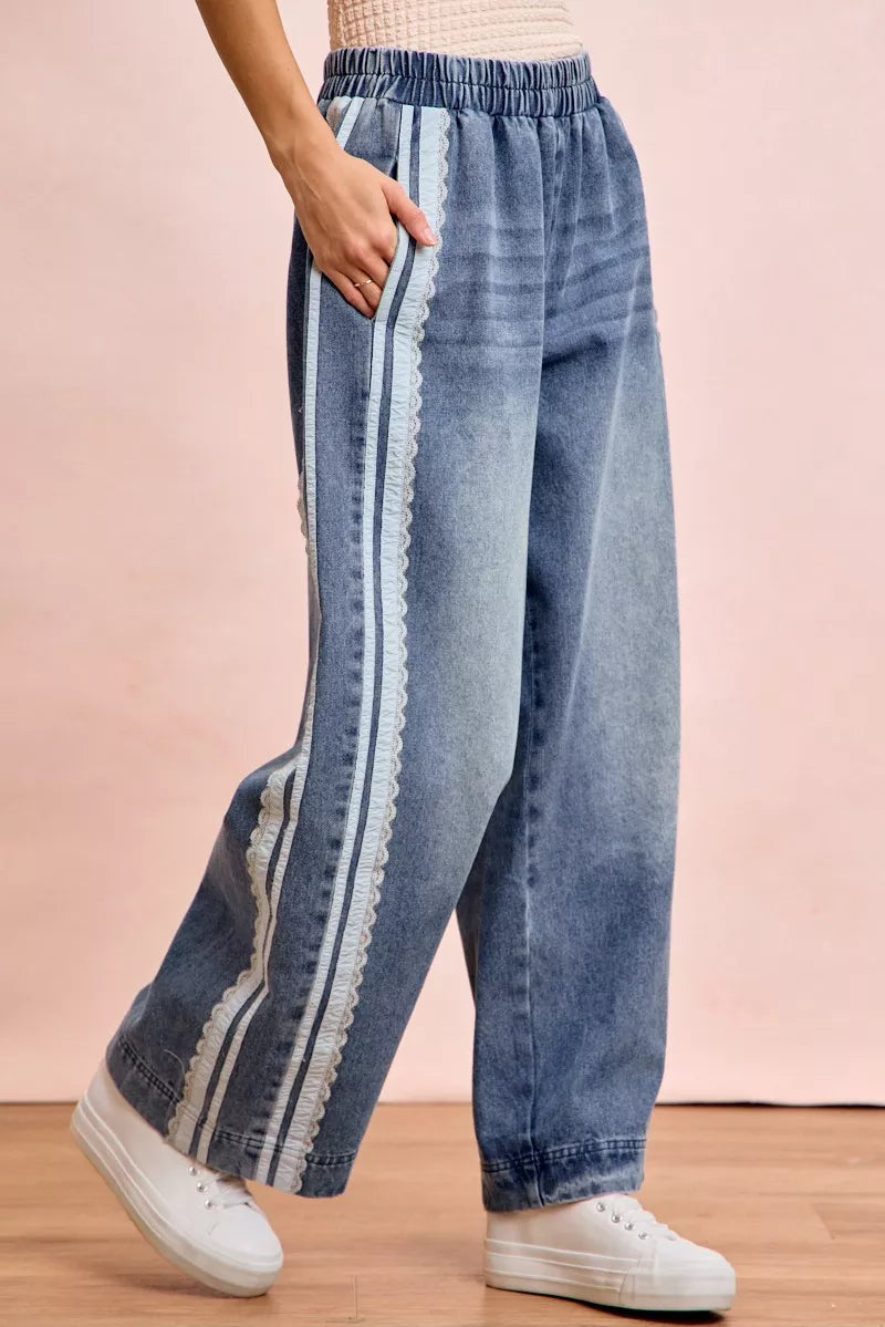 Trendsi BiBi washed lace contrast-sided jeans featuring distressed denim, lace accents, and a relaxed fit.