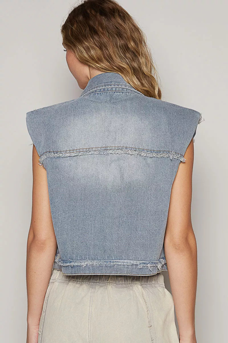 Trendsi raw hem denim vest with asymmetrical front closure, sleeveless design, and classic blue wash, styled with casual outfit.