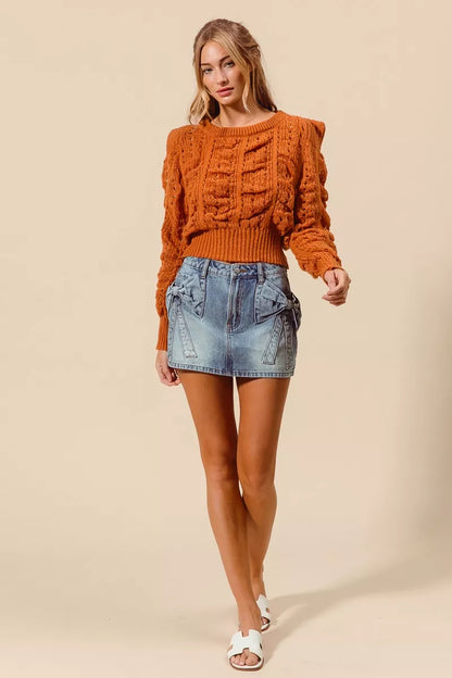 Trendsi SO ME bow knot pocket denim mini skirt featuring a stylish front bow knot detail and front pockets.