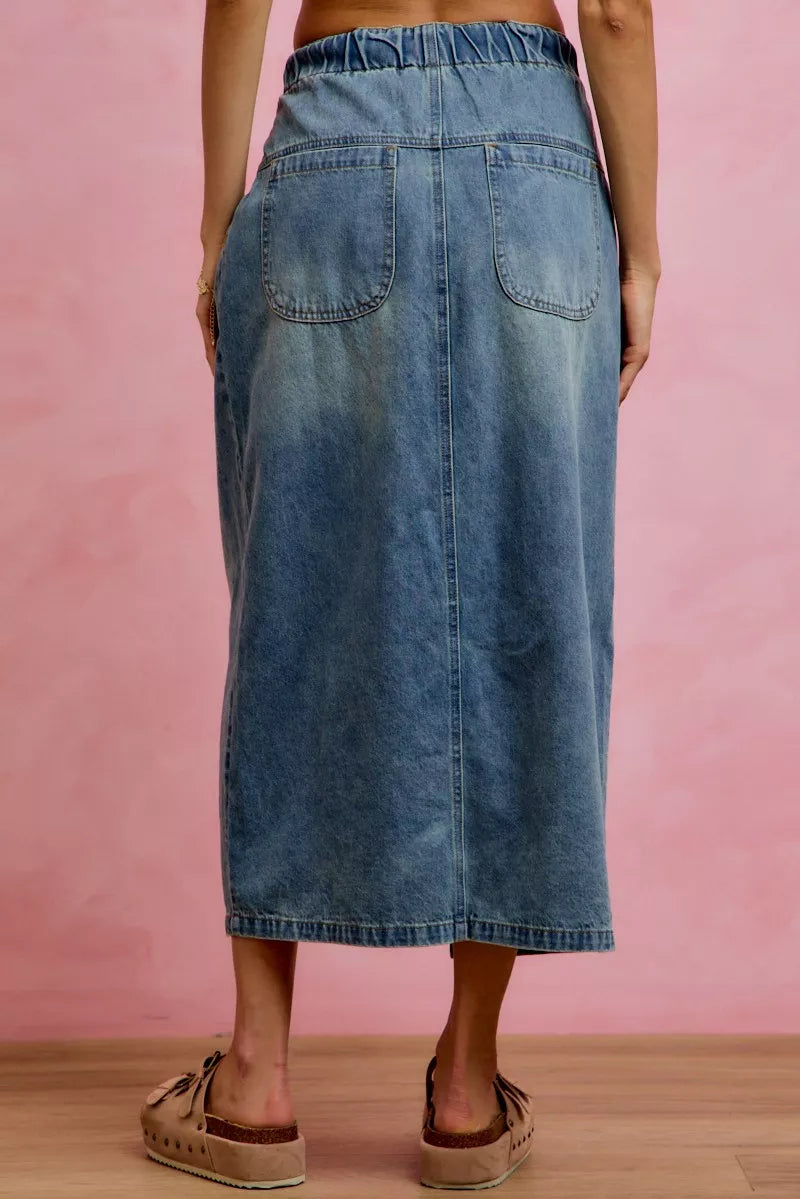 Trendsi SO ME pleated washed denim skirt with front slit, showing a stylish high-waisted design and casual denim texture.