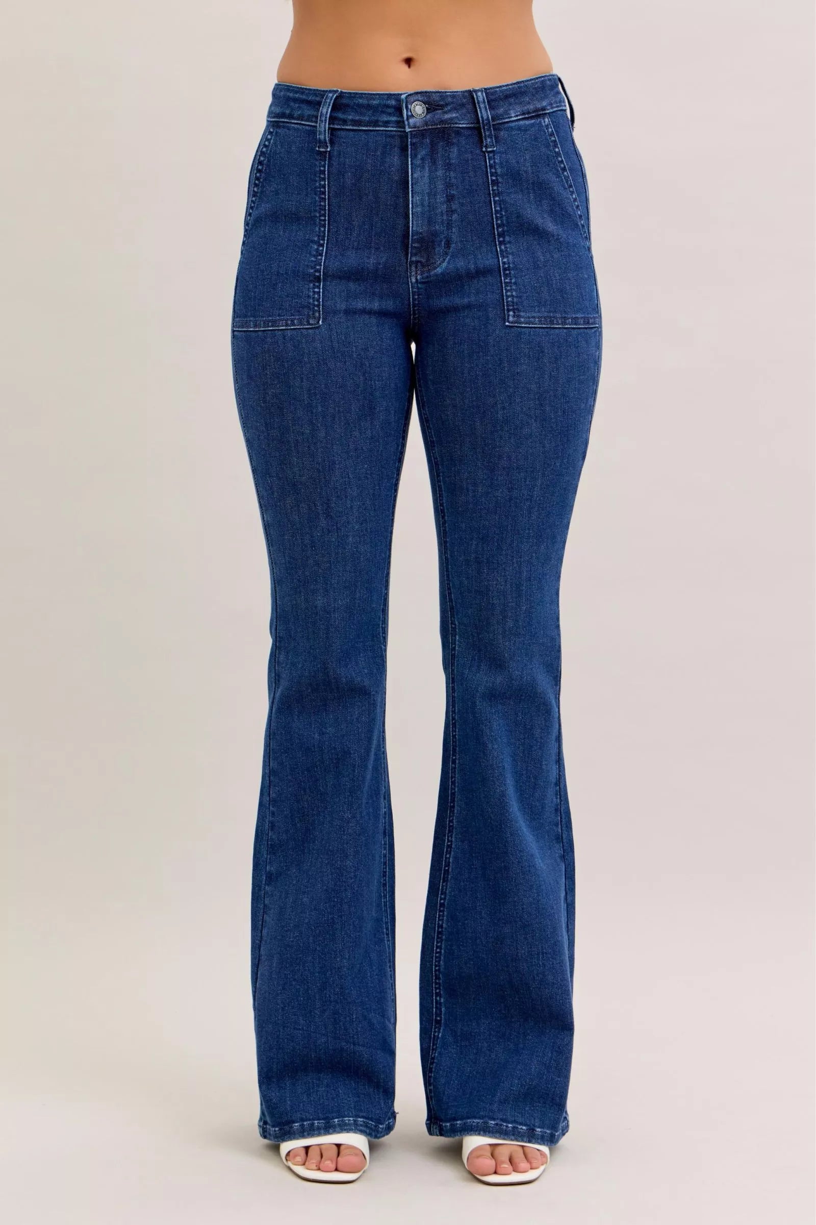 Judy Blue high waist flare jeans with front patch pockets, stylish denim pants featuring a fitted waist and flared leg design.
