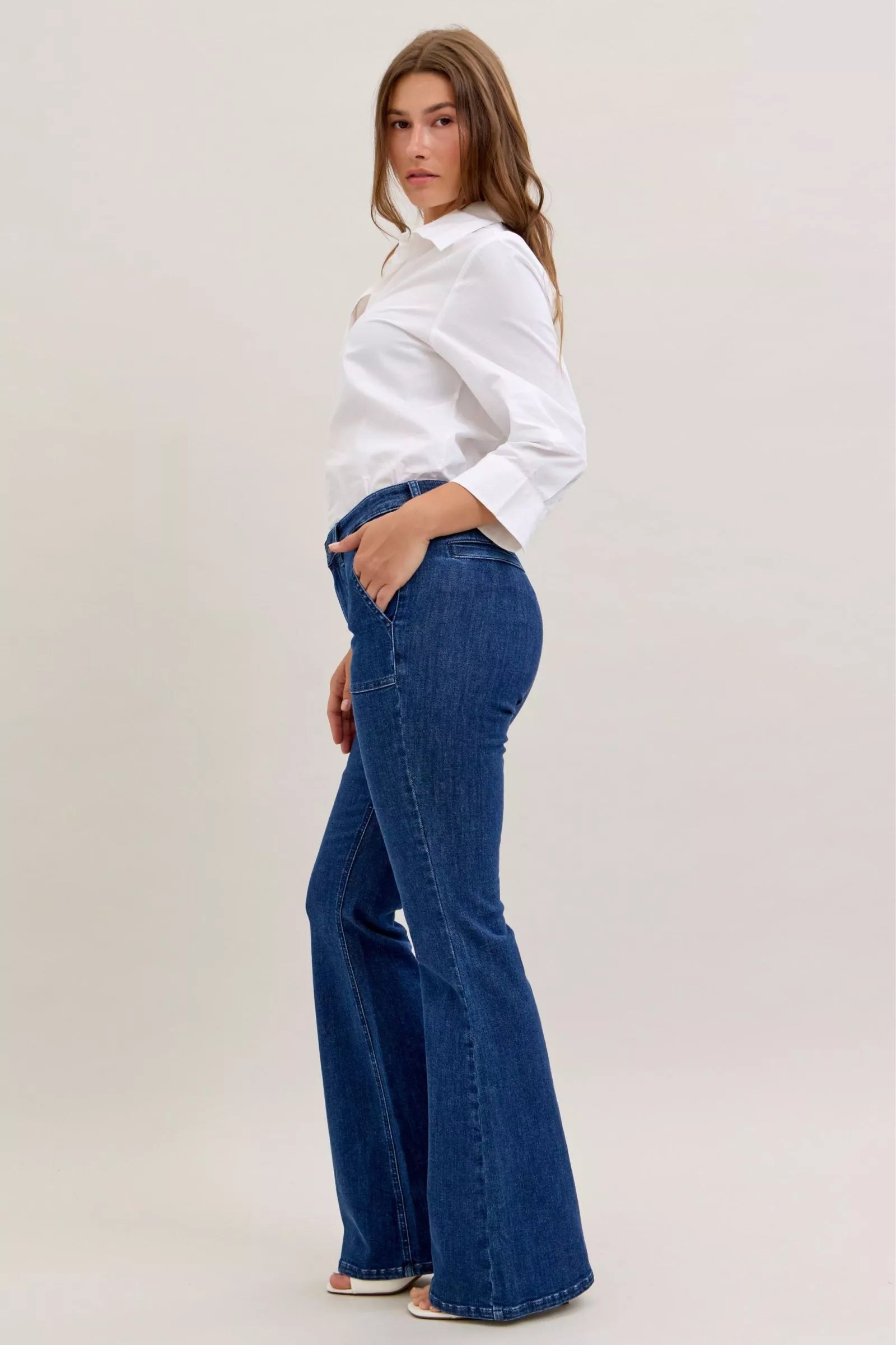 Trendy Judy Blue high waist flare jeans with front patch pockets, shown in a natural denim wash.