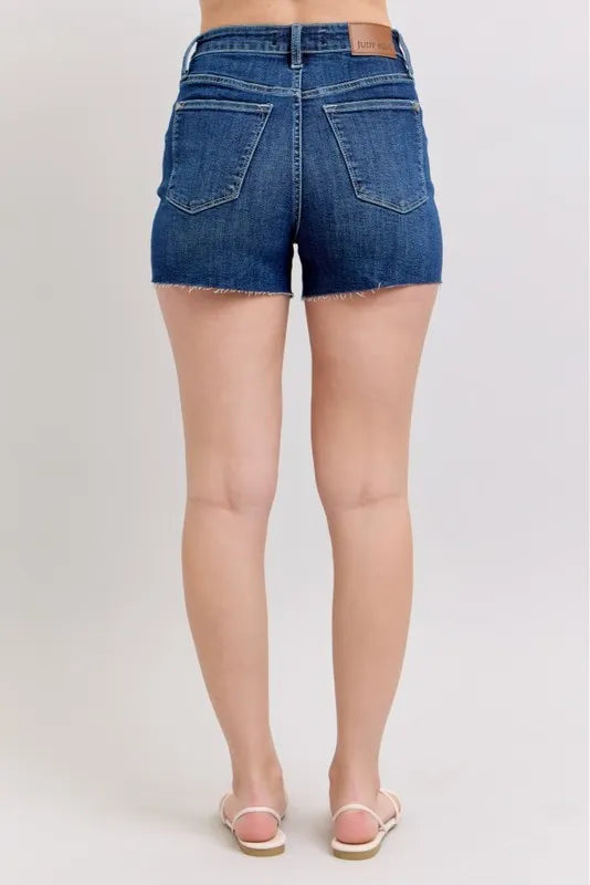 Plus size Judy Blue high waist denim shorts with criss-cross waistband, showcasing the stylish fit and design.